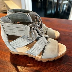 Never been worn six 9 Sorel sandals. Tan with lace up. Very comfortable.